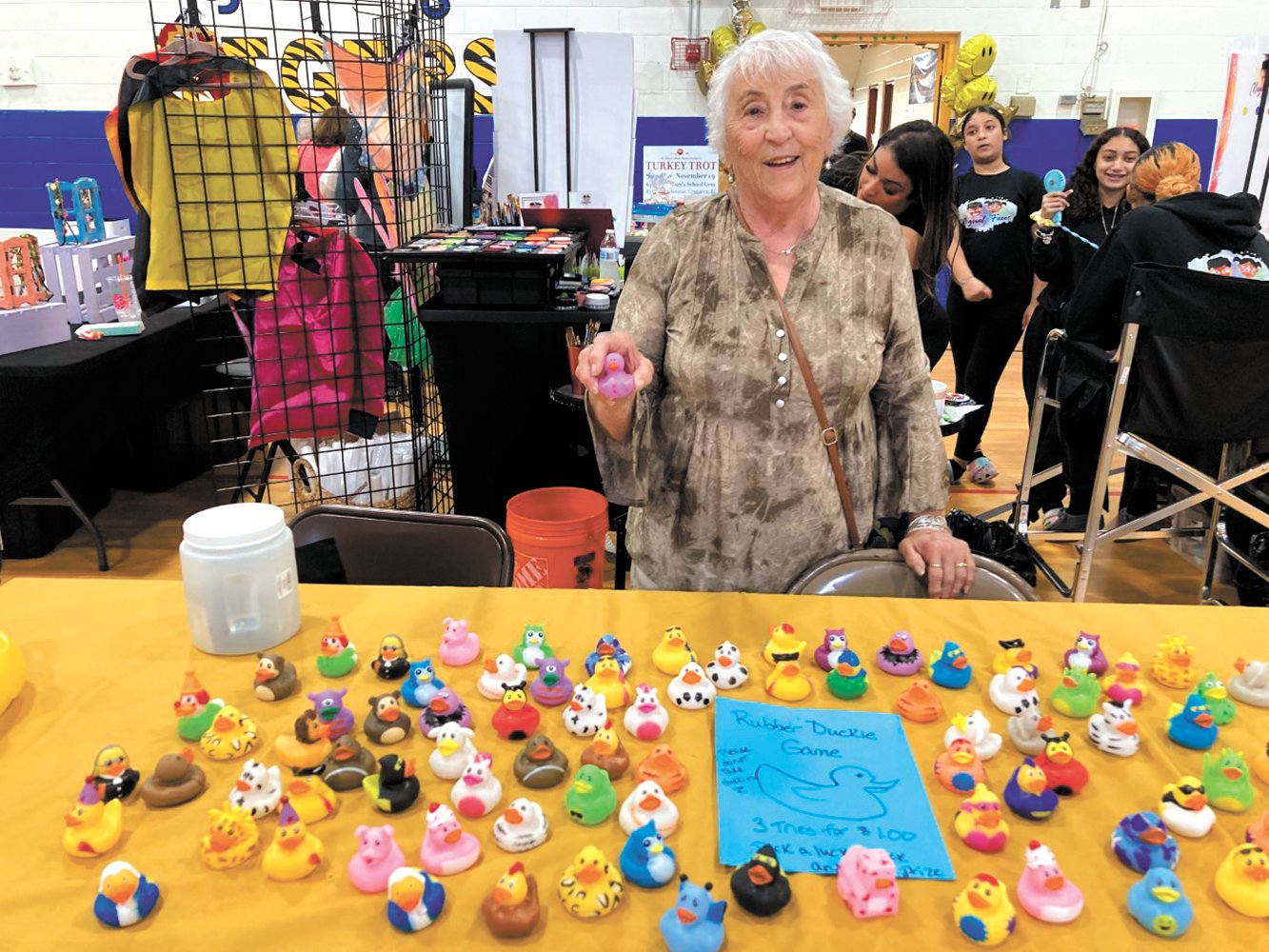 A GAME OF DUCKS: Ann Marie Mullaney ran a rubber duckie game at Saturday’s event. For $1, individuals had three tries to pick the lucky duck with the number on the bottom of it. If you had the correct pick, you won a prize!